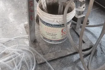 Waterproofing grouting machine in action Advanced equipment applying waterproofing grout for long lasting protection against water damage